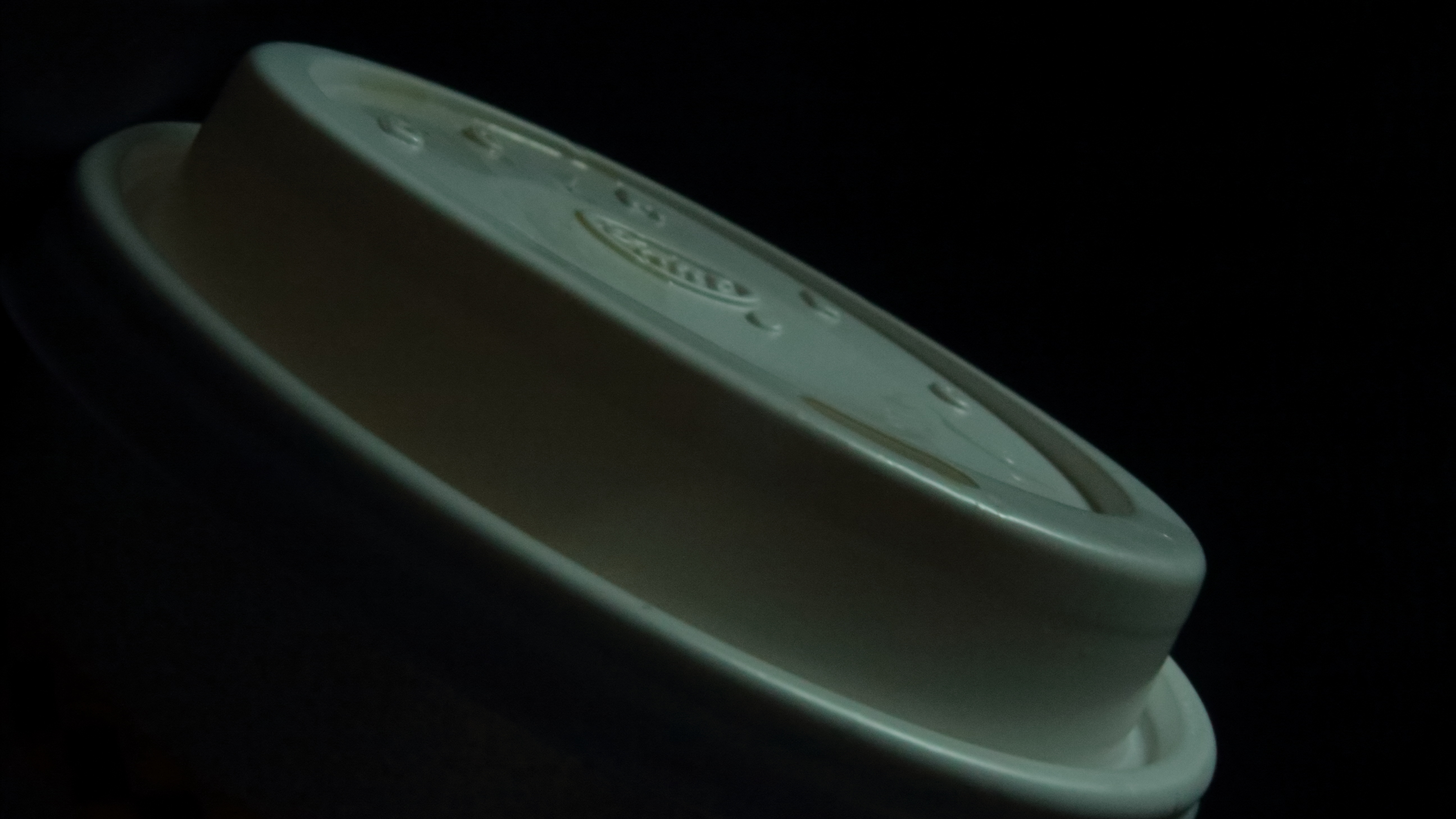 A very stylized picture of a plastic lid